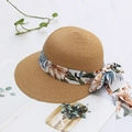 Straw sun hat with floral ribbon and bow for women, wide brim beach style in khaki brown - Adjustable / Khaki