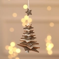 Handcrafted wooden Christmas tree ornament with bell and stars against warm bokeh light - Five-pointed Star / Gray