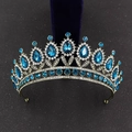 Detailed close-up of Baroque crown featuring blue teardrop gemstones on a bronze base - Antique Bronze With Peacock Blue