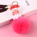 Llavero de pompon rosa con colgante de Papá Noel en cuero y mosquetón dorado para bolsos - Papá Noel Estilo C