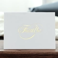 White greeting card with gold foil Thank You lettering on a natural wooden desk - Thank You Bronzing Greeting Card (371-C)