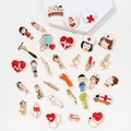 Variety of medical themed enamel pins including cute doctor and nurse figures - Random Small Size