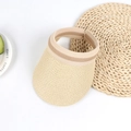 Detail view of woven straw sun hat with striped elastic band on a white surface - Adult (56-58cm) / Beige