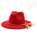 Detail of red wool felt fedora featuring bohemian feather accents and wooden beads trim - M (56-58cm) / Red
