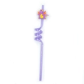 Dettaglio di una cannuccia viola con dinosauro per feste di compleanno e bambini - Viola