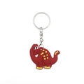 Close-up of a red silicone dinosaur keychain with yellow dots and silver metal ring - Red Cartoon Dinosaur
