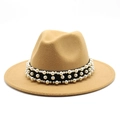 Detail of camel wool fedora hat featuring black band with white pearl embellishments - Camel