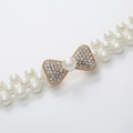 Eleganter elastischer Perlen-Taillengürtel mit goldener Strass-Schleife für Kleider - Schleife