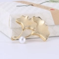 Elegant matte gold ginkgo leaf brooch featuring dual leaves and a white accent pearl - 1302-Gold Ginkgo Leaf Pearl