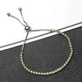 Macro detail of adjustable silver bolo bracelet with round green cut gemstones - Green