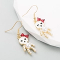 Gothic skull earrings with red bow and white pearl drop design in golden finish - Pearl Bow Skeleton / Pearl White