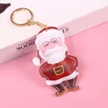 Christmas Santa plush keychain with white stitching and gold metal ring on pink background - Light Gold Ring Santa