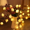 Warm white LED rose flower string lights wrapped around a floral vase for decoration - 2m 10 LEDs (Battery Operated) / White