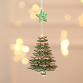 Detail of wooden Christmas tree ornament with star top and bell in festive green and natural wood - Snowflake Style / Green