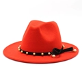 Elegant red wool fedora hat with pearl chain band and side bow decoration on white background - Orange Red