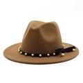 Macro shot of camel wool fedora hat with black band and white pearl tassel detail - Light Coffee