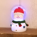Palla di cristallo con pupazzo di neve luminoso e cappello rosso su scaffale - Pupazzo di Neve Testa Grande