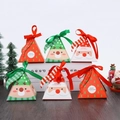 Close-up of triangular kraft paper Christmas gift boxes with ribbons and holiday patterns - 12Pcs Triangular Pyramid Boxes