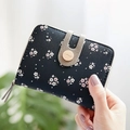 Women's black floral print short wallet with lychee textured leather and gold buckle - Black
