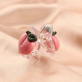 Macro detail of cute pink peach hair claw clips with green leaves on pink silk - Peach Claw Clip