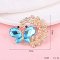 Detailed view of a gold-tone butterfly brooch with blue crystals and measurement specs - D185 Butterfly Wreath Design