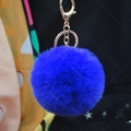 Blue faux rabbit fur pom pom keychain with gold lobster clasp and plush fluffy texture - Blue