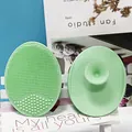 Light green silicone facial cleansing brush with soft dual-sided bristles and suction cup - Grass Green