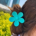 Matte Tiffany blue flower hair claw clip for women in an elegant bun hairstyle look - 7cm / Teal