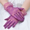 Close-up of elegant purple floral lace gloves with ruffled cuffs and rose patterns - One Size / Purple