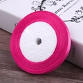 Single roll of rose pink satin ribbon on a wooden table, 6mm wide for gift DIY wrapping - Rose Red
