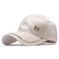 Close-up of satin champagne baseball cap with golden M letter and metallic brim detail - Adjustable / Flesh Pink