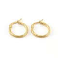 Polished gold circular hoop earrings with twisted spiral texture on white background - Gold