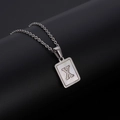 Minimalist stainless steel necklace with square shell pendant featuring capital letter X - Silver Letter X
