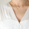Elegant gold chain necklace featuring five white imitation pearls on lace clothing - 40+5cm / Gold Necklace