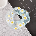 Light blue mesh scrunchie with daisy floral print on a textured stone surface - Mesh Style / Light Green Daisy Mesh Scrunchie