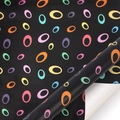 Modern black gift wrapping paper featuring vibrant colorful hollow oval patterns - Colorful Circles