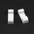 Macro shot of white plastic base stands for transparent suspension jewelry display boxes - 1 Pair Long Strip Bases / White