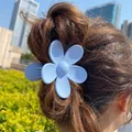 Matte light blue flower hair claw clip in minimalist five-petal resin design on brown hair - 7.2*7.2*4.1 / Light Blue