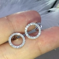 Elegant hollow circular stud earrings in silver with shimmering pavé zircon stones - White Gold