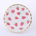 Detailed top view of white disposable paper plate with red strawberry prints and gold edges - Small Strawberry Paper Plates