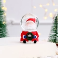 Schneekugel mit Weihnachtsmann, roter Basis und glitzernden Partikeln als Dekoartikel - Kleiner Weihnachtsmannballon