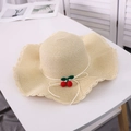 Beige woven straw sun hat for women featuring wavy brim and red cherry charm decor - M / Beige