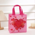 Pink non-woven Valentine's gift bag with red hearts and golden ribbon handles - 23x22x11cm / Gold Ribbon Heart Pattern