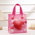 Pink non-woven Valentine's gift bag with red and white heart patterns and sturdy handles - 23x22x11cm / Mini Heart Prints Pattern