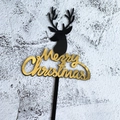 Black reindeer silhouette and golden Merry Christmas acrylic cake topper on grey background - Black Elk Style / Black/Gold