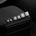 Detail view of six pairs of square halo stud earrings with brilliant round center stones - Silver (3 Pairs Set)