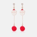 Macro view of Santa Claus enamel earrings with red pompoms and white pearl details - Santa Claus Tassel Stud Earrings