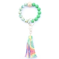 Detail of beaded key ring with green beads, wooden hex bead and colorful tie-dye tassel - Style 26 (Green Texture Tie Dye Tassel)