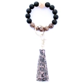 Close-up of leopard print beads and leather tassel on a beaded wristlet keychain - Style 9 (Black Matte Leopard Tassel)