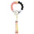 Close-up of silicone beads keychain with leopard fringe and gold lobster clasp - Style 33 (Coral Orange Space Black Marble)